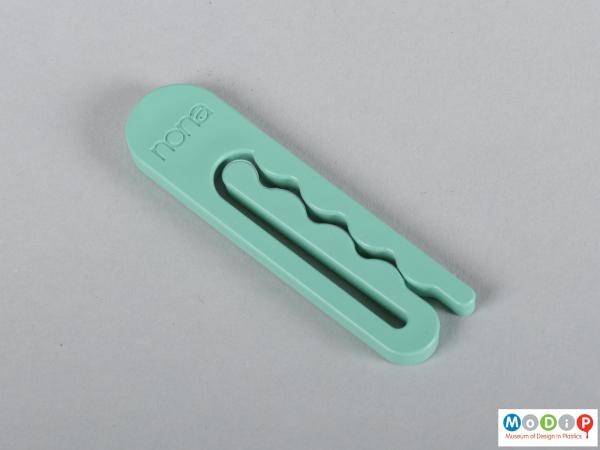 Front view of a clothes peg showing the wave design.