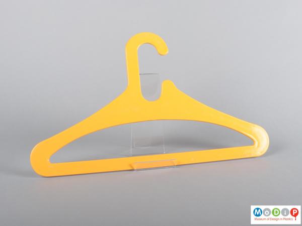 Front view of a coat hanger showing the sloping shoulders.