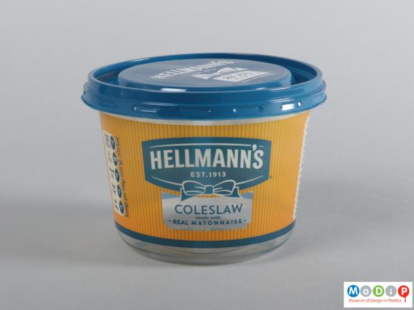 Side view of a coleslaw tub showing the printed side and blue lid.