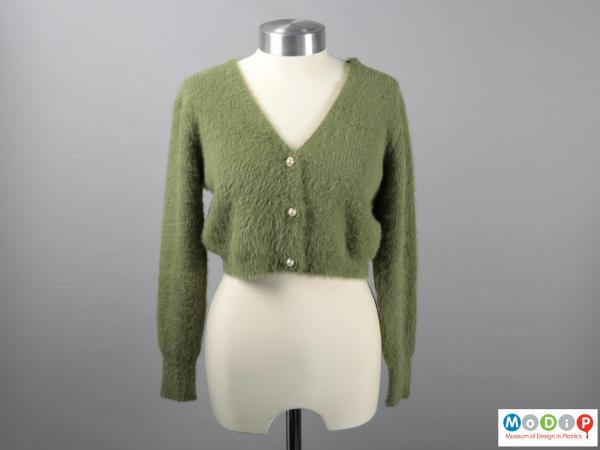 Side view of a cardigan showing the short body length.
