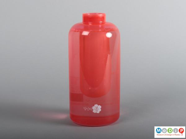 Side view of a fire extinguisher showing the cylindrical shape.