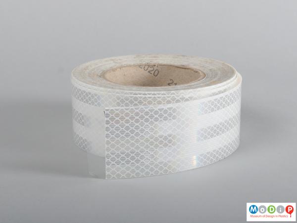 Side view of a roll of tape showing the patterning.