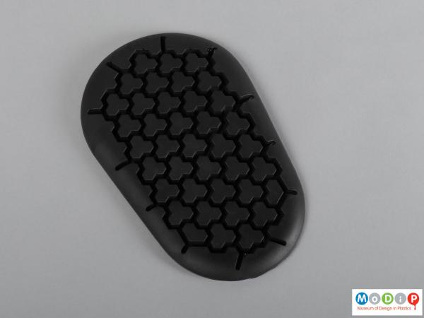 Front view of a protective pad showing the tripleflex pattern.