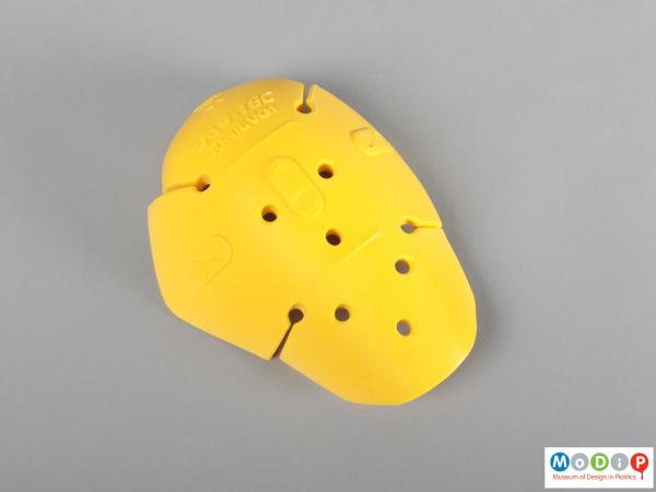 Front view of a protective pad showing the rounded shape.