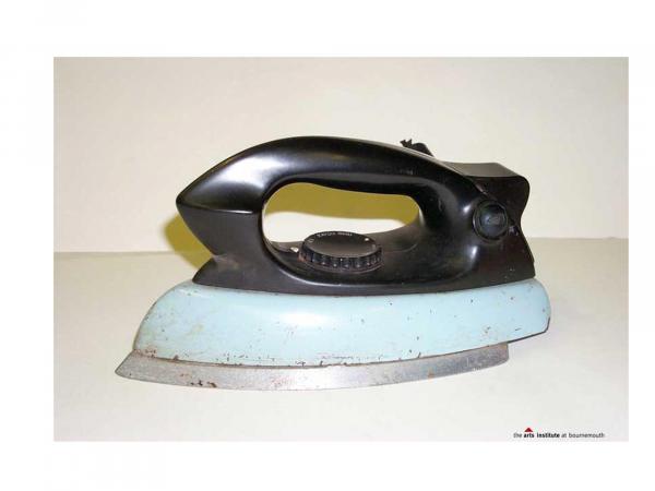 Side view of an iron showing the large black handle.