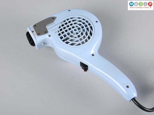 Side view of a hair dryer showing the long handle.