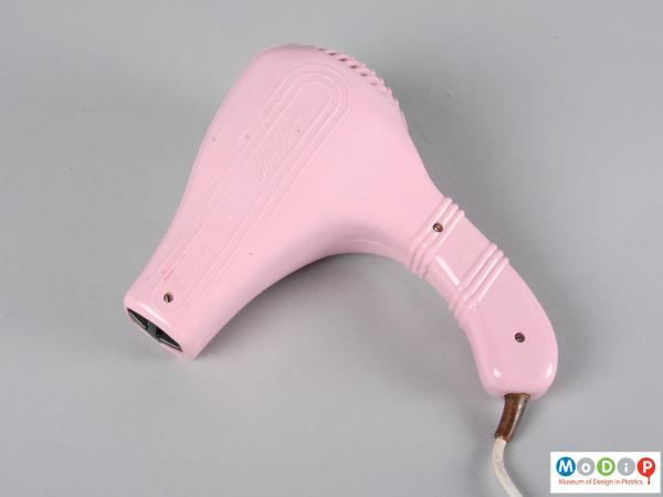 Side view of a hairdryer showing the ribbed handle.