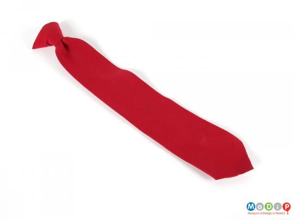 Front view of a tie showing the plain red fabric.