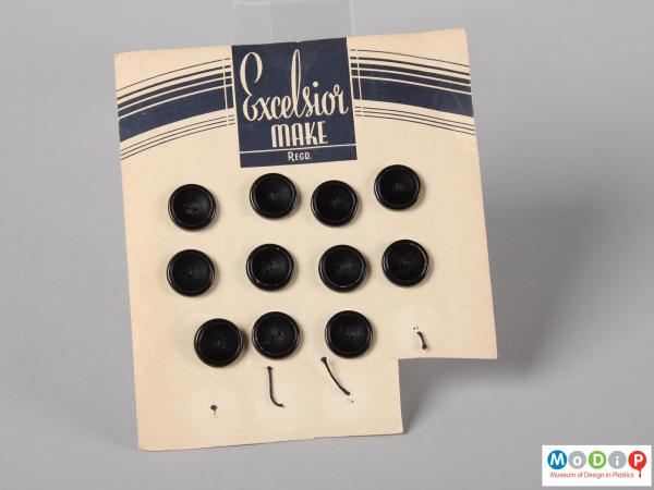 Front view of an Excelsior button card showing four columns of buttons.