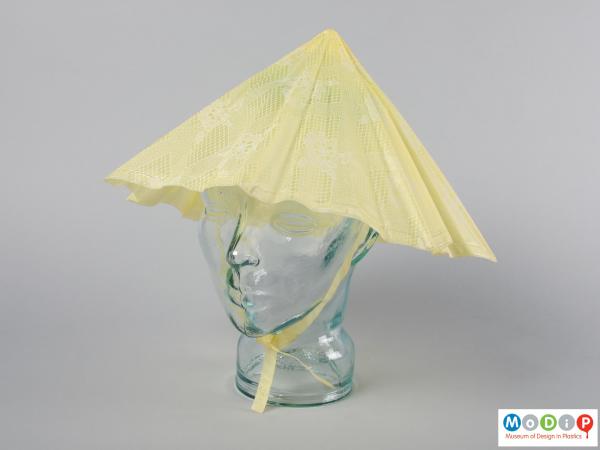 Front view of a rain hat showing the triangular shape.