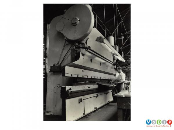 Scanned image showing a large break press.