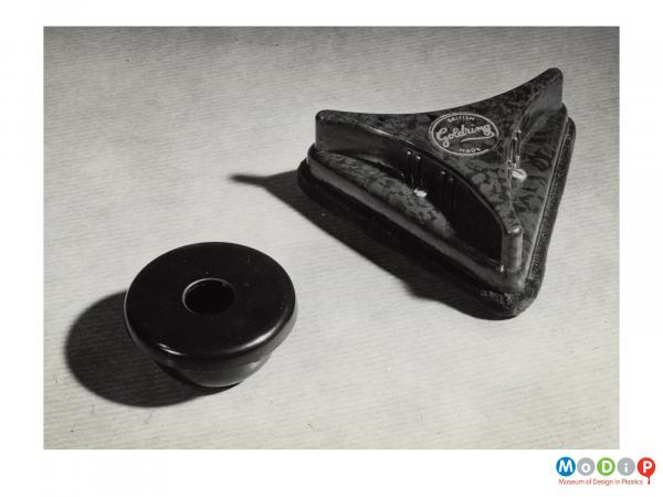 Scanned image showing moulded gramophone accessories.