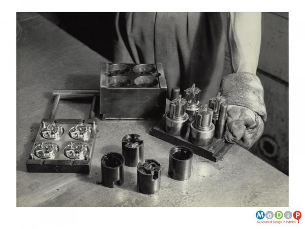 Scanned image showing moulded lamp holders.