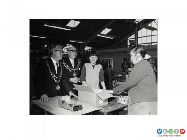 Scanned image showing a mayoral visit to a factory.