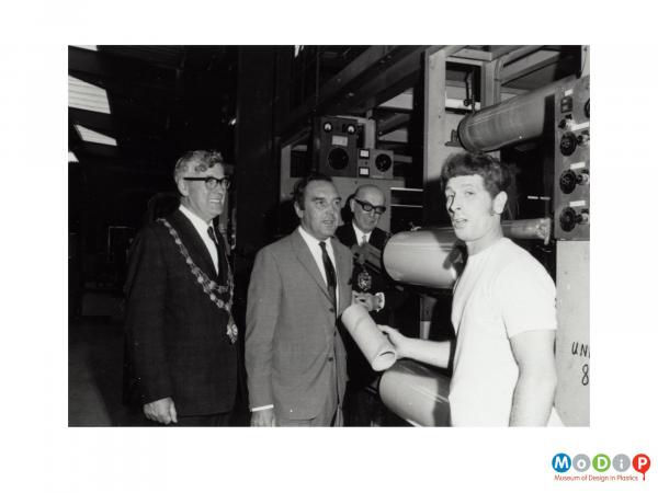 Scanned image showing a mayoral visit to a factory.