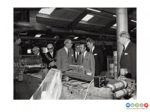 Scanned image showing a mayoral visit to a factory.