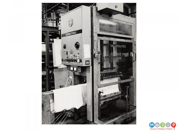 Scanned image showing machine making plastic bags.