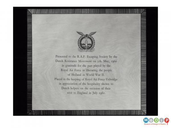 Scanned image showing a printed plaque.
