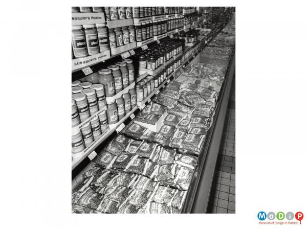 Scanned image showing a packaged frozen peas in a supermarket.