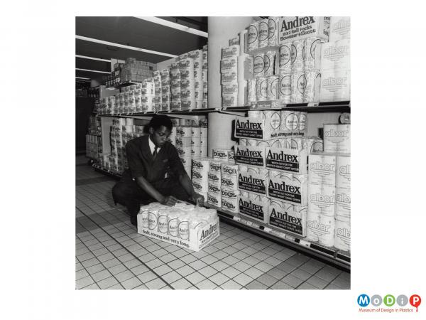 Scanned image showing a man in a supermarket.