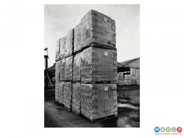 Scanned image showing stacks of shrink wrapped bricks.