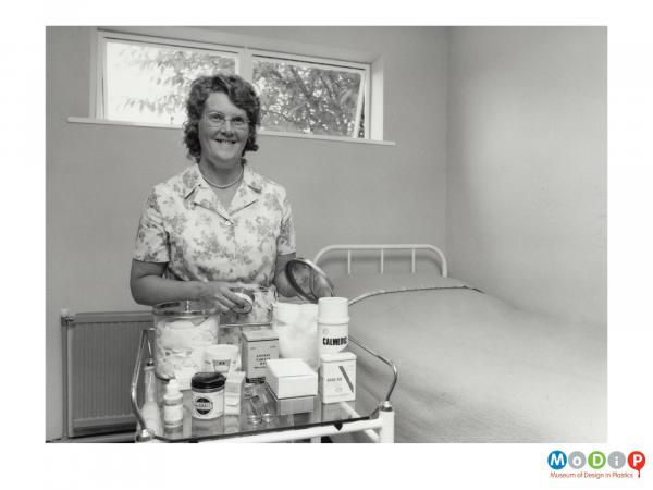 Scanned image showing a woman in a first aid room