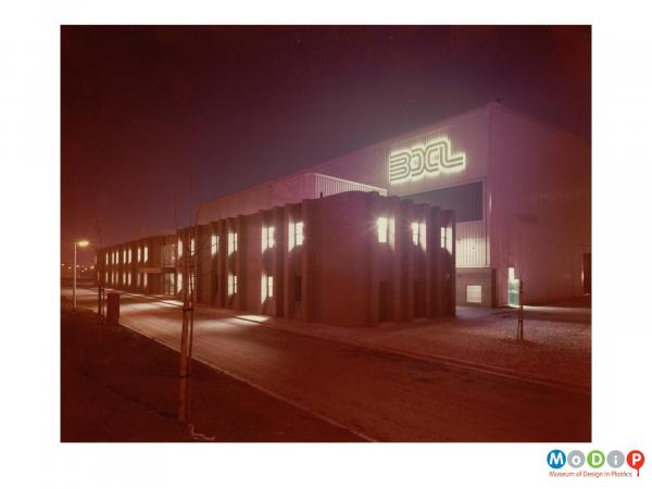 Scanned image showing an exterior view of a factory building.