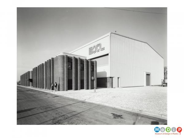 Scanned image showing an exterior view of a factory building.