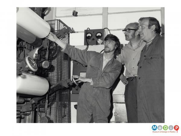 Scanned image showing a group of men undergoing training.