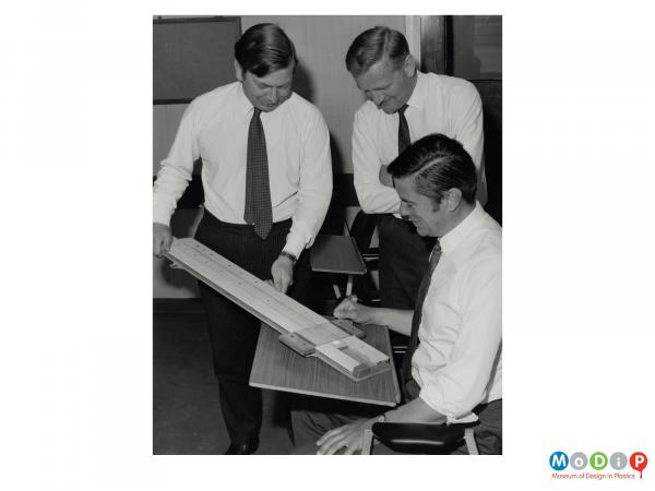 Scanned image showing a group of men undergoing training.