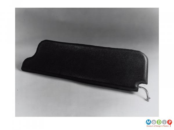 Scanned image showing a sun visor from a car.