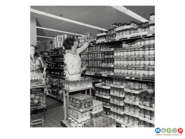 Scanned image showing shrink wrapped products waiting to be put on shelves in a supermarket.