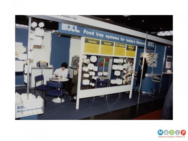 Scanned image showing a food tray diplay stand.