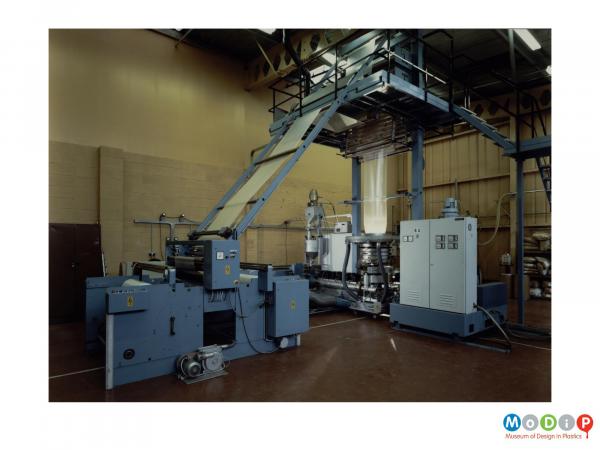 Scanned image showing an extruding machine.