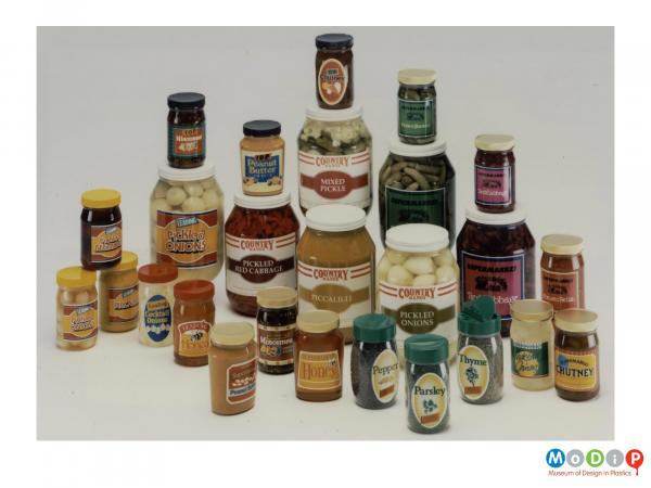 Scanned image showing a range of different shaped and sized clear jars.