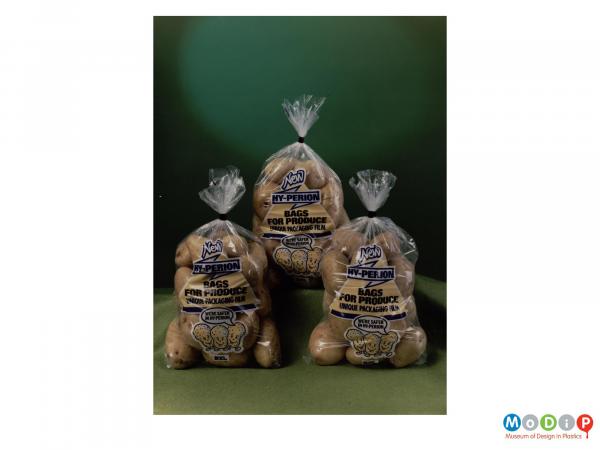 Scanned image showing three bags of potatoes.