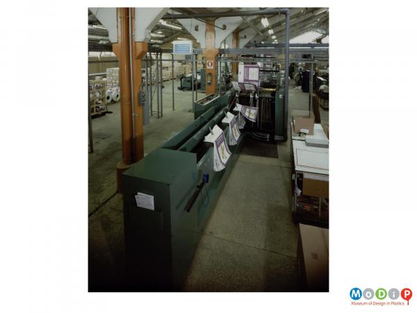 Scanned image showing packaging on a production line.