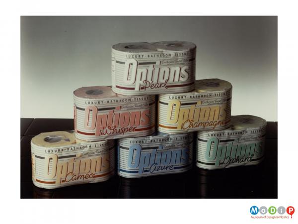 Scanned image showing a range of different coloured packaging for toilet roll.