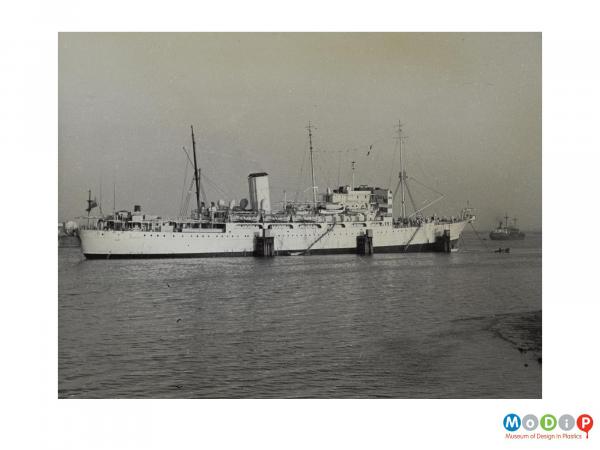 Scanned image showing a large ship at sea.