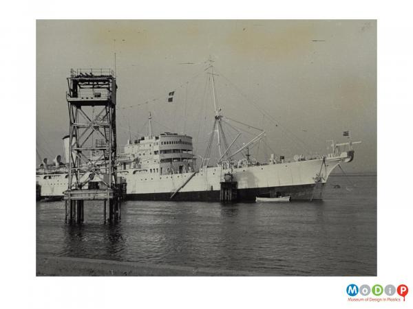 Scanned image showing a large ship at sea.