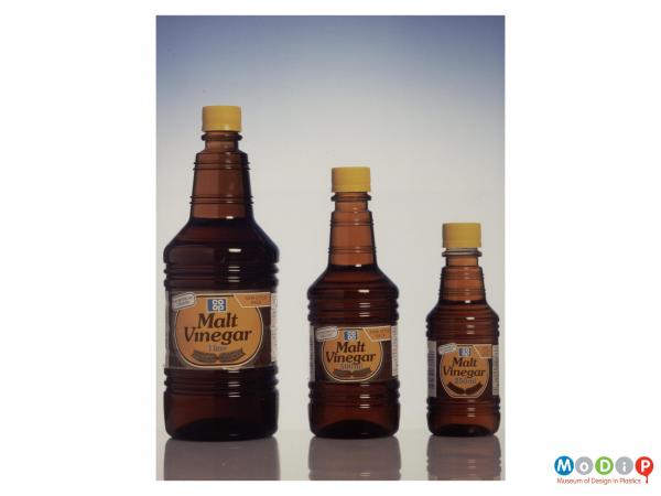 Scanned image showing 3 sizes of malt vinegar bottles.