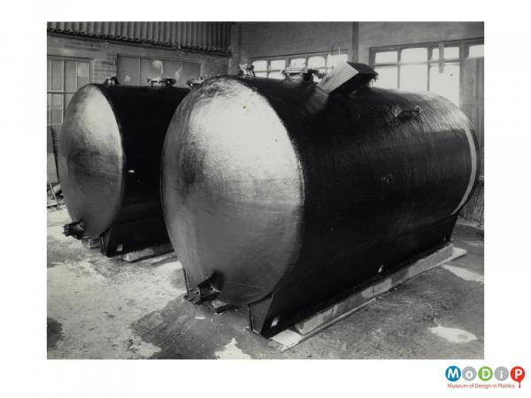 Scanned image showing two storage tanks.