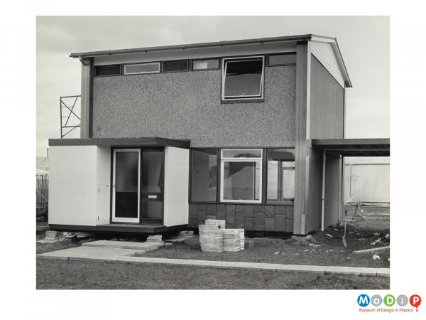 Scanned image showing a house with cladding.