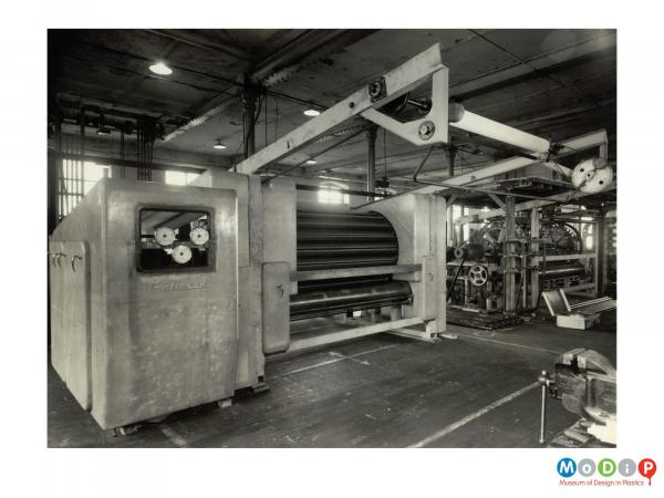 Scanned image showing saftey rails around a machine.