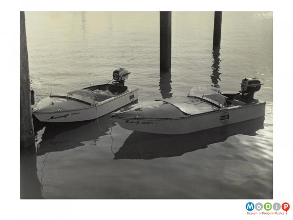 Scanned image showing 2 small motor boats.