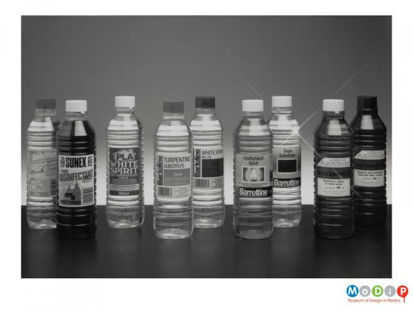 Scanned image showing 9 bottles used for household chemicals.