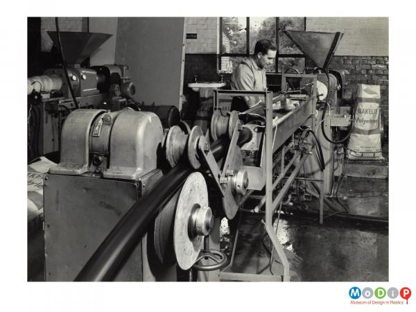 Scanned image showing pipe being extruded.