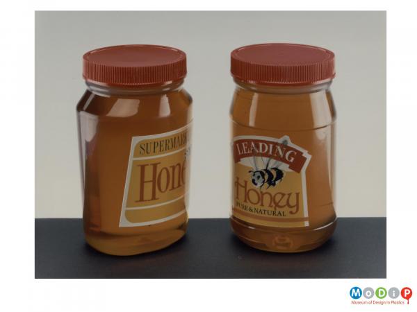 Scanned image showing 2 jars of honey.