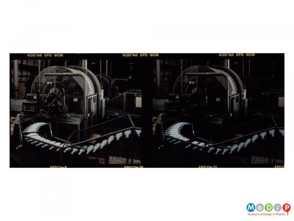 Scanned image showing a contact sheet of 2 images of bottles on a production line.