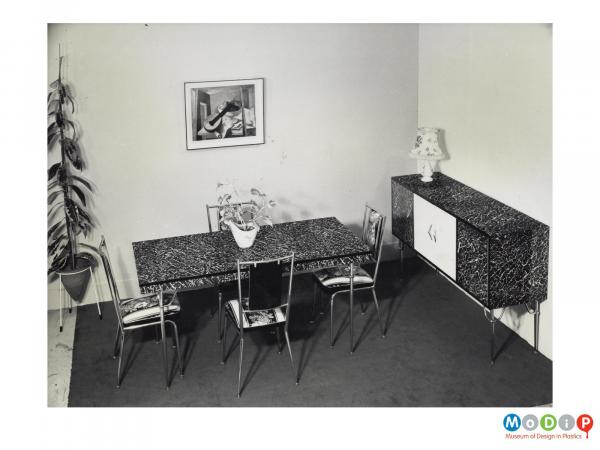 Scanned image showing a table and dining table with matching sideboard.